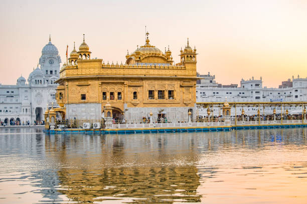 istock Golden temple view from the sides showing building and its reflection 1078347866