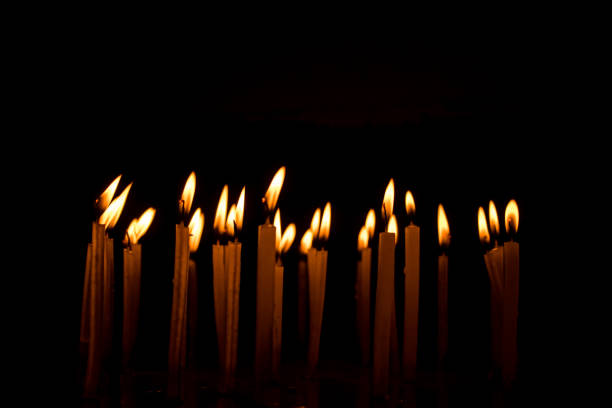 istock Many christmas candles burning at night on the black background. 1078355896