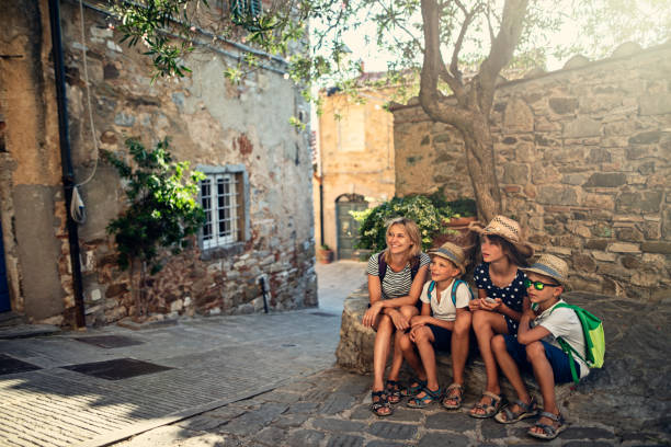 istock Family enjoying sightseeing small Italian town 1078357664
