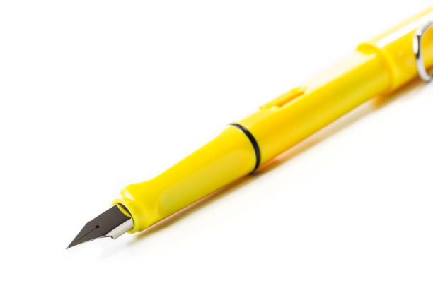 istock yellow modern fountain pen isolated on white, close up 1078357762
