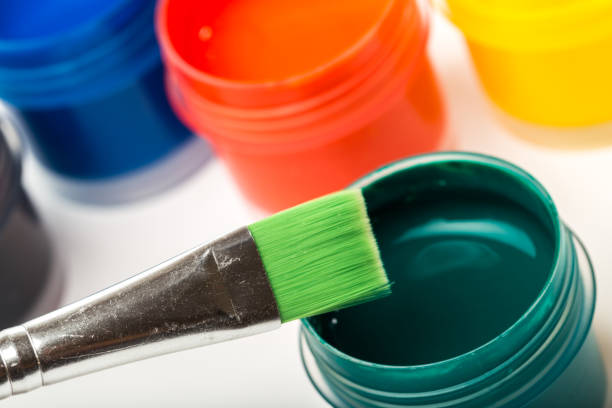 istock bottle paints on white, gouache, brush close up 1078357772