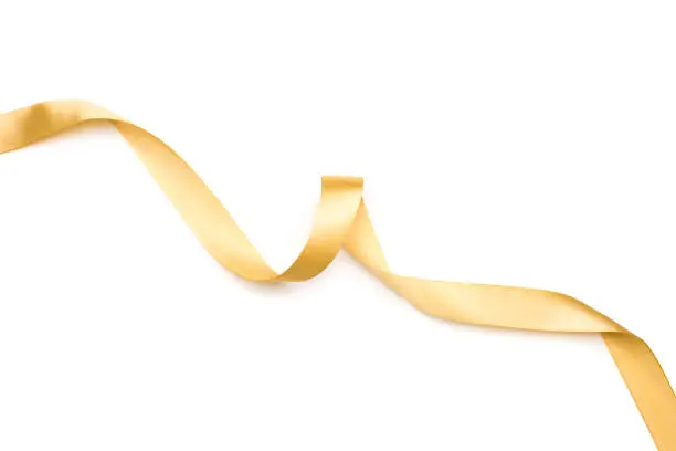 Photo of golden satin ribbon isolated on white background