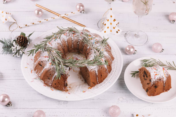 istock Traditional Christmas fruit cake on a white wooden table. 1078374232