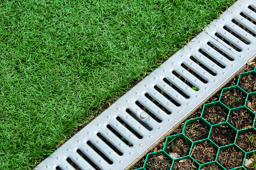 Weathering for water in a court, a green grass