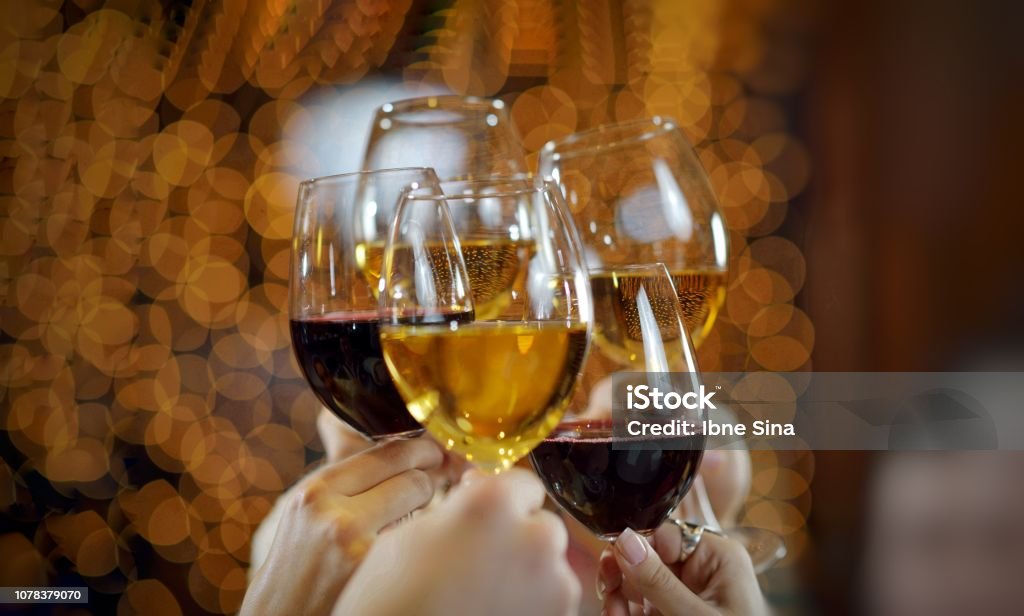 New year Red wine glass celebration 2019. hand with lots of alcoholic drink Wine Stock Photo