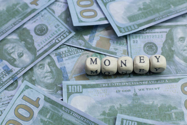 istock money word on wood brick  background banknote. 1078384674