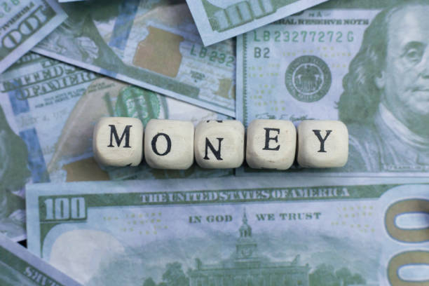 istock money word on wood brick  background banknote. 1078384914