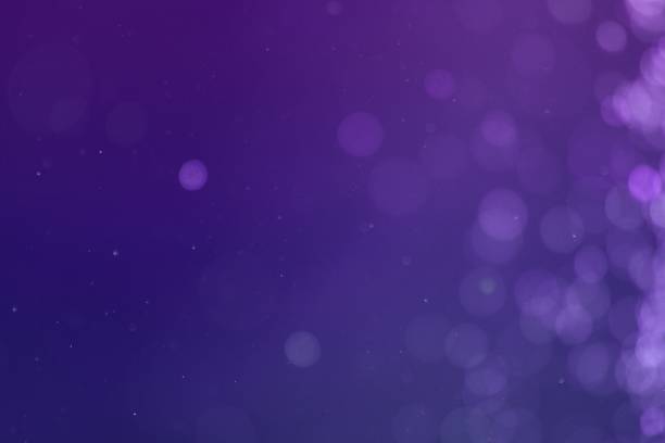 istock purple sparkling sparks one side frame bokeh texture - pretty abstract photo background 1078385832