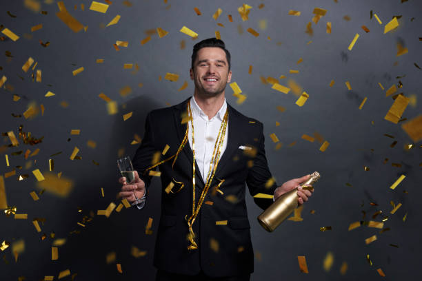 istock Portrait of smiling man drinking alcohol at studio shot 1078387860