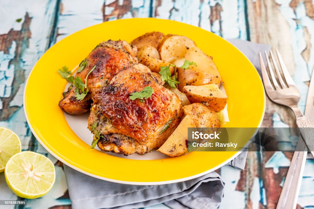 Roasted Chicken Thighs Roasted Chicken Thighs Served with Lemon Grilled Chicken Stock Photo
