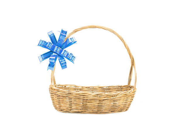 Empty wicker basket with blue ribbon isolated on white background