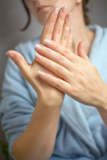 istock Hand care. Applying hand cream 1078388034