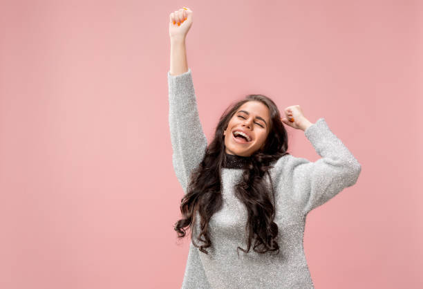 istock Winning success woman happy ecstatic celebrating being a winner. Dynamic energetic image of female model 1078390120