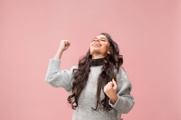 istock Winning success woman happy ecstatic celebrating being a winner. Dynamic energetic image of female model 1078390130