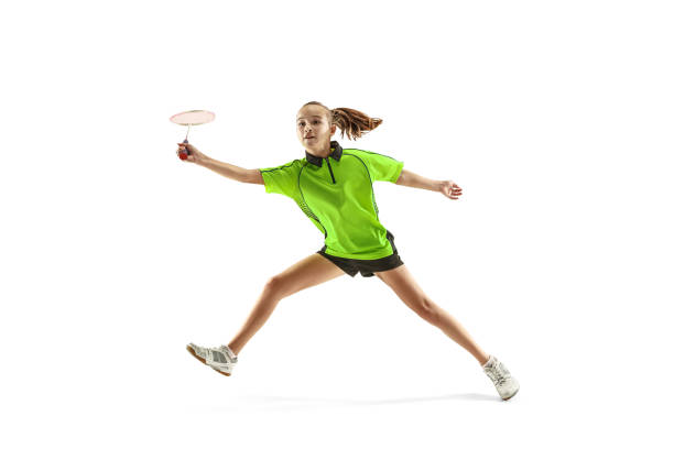 白い背景に分離されたバドミントン プレーヤーを再生 1 白人若い 10 代女 - badminton racket isolated white ストックフォトと画像