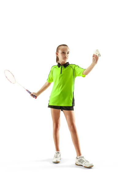 白い背景に分離されたバドミントン �プレーヤーを再生 1 白人若い 10 代女 - badminton racket isolated white ストックフォトと画像