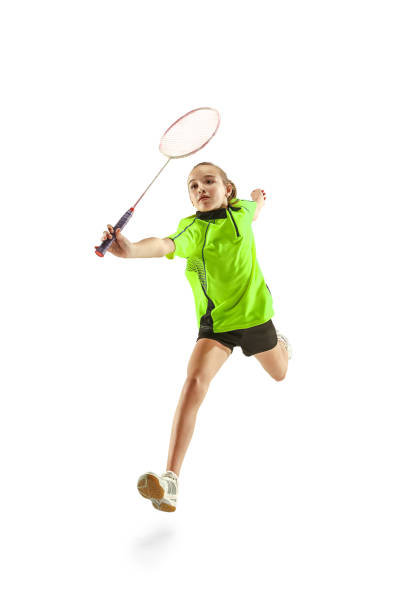 白い背景に分離されたバドミントン プレーヤーを再生 1 白人若い 10 代女 - badminton racket isolated white ストックフォトと画像