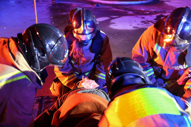 istock Firefighters helping an injured man 1078395780