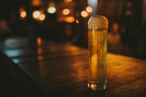 istock A cold beer pint on a bar counter, vintage style. 1078410500