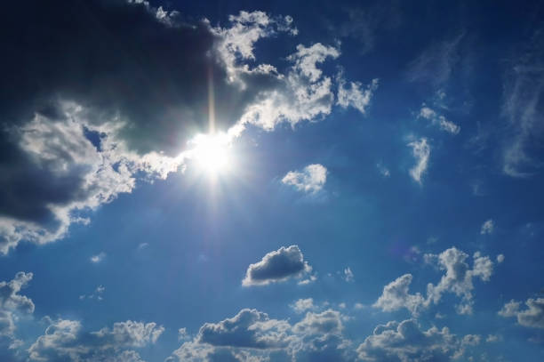 istock Blue sky after rain with white dark colored fluffy clouds. Background texture. 1078410950