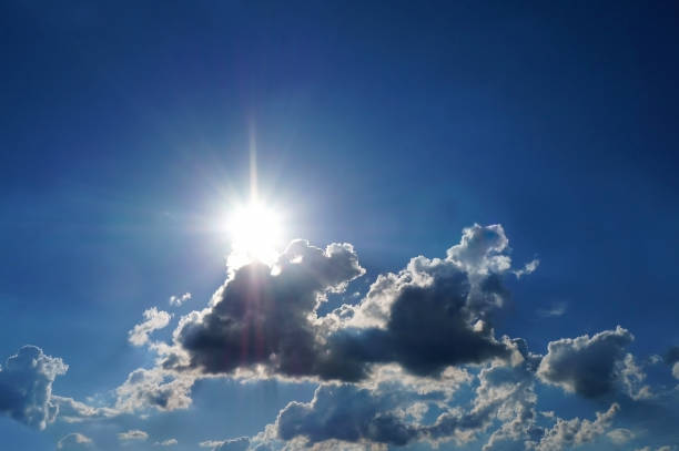 istock Blue sky after rain with white dark colored fluffy clouds. Background texture. 1078410956