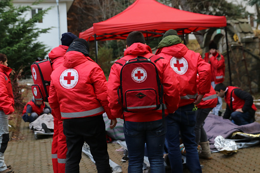 Sofia, Bulgaria - December 5, 2018: Volunteers from the organization of the Bulgarian Red Cross participate in training with a fire service. They help provide first aid to people after an earthquake and fireSofia, Bulgaria - December 5, 2018: Volunteers from the organization of the Bulgarian Red Cross participate in training with a fire service. They help provide first aid to people after an earthquake and fire