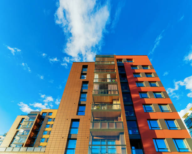 istock Facade modern apartment house copy space blue sky clouds 1078414520
