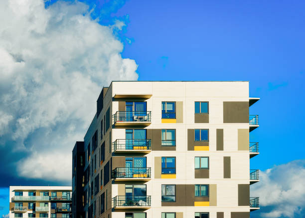 istock Facade of apartment house copy space blue sky clouds 1078414664