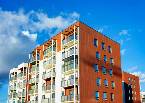 istock Modern new apartment house copy space blue sky clouds 1078415904