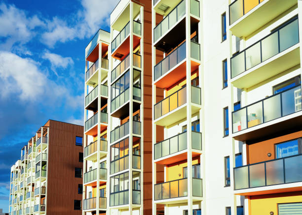 istock Facade of modern apartment house copy space blue sky clouds 1078415910