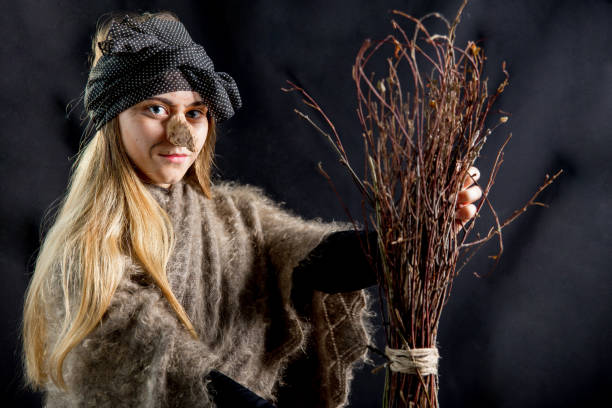 istock A young woman wearing a witch costume 1078420700