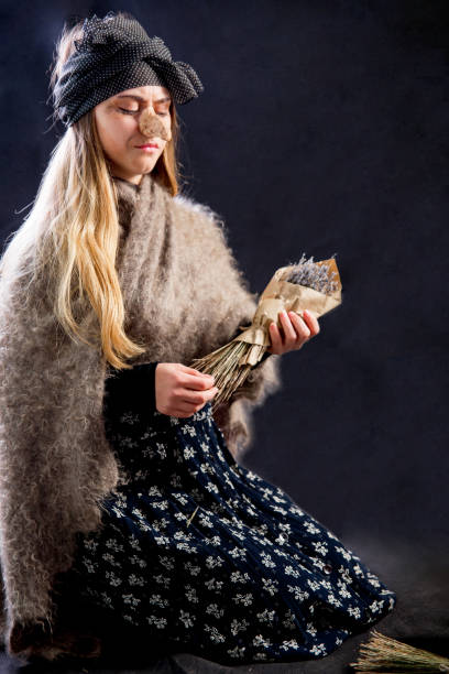 istock A young woman wearing a witch costume 1078420814