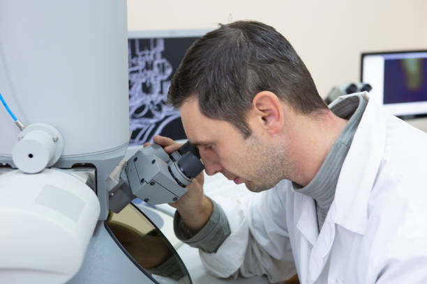 istock scientist working at the laboratory. Screen image of molecule made by myself 1078424810