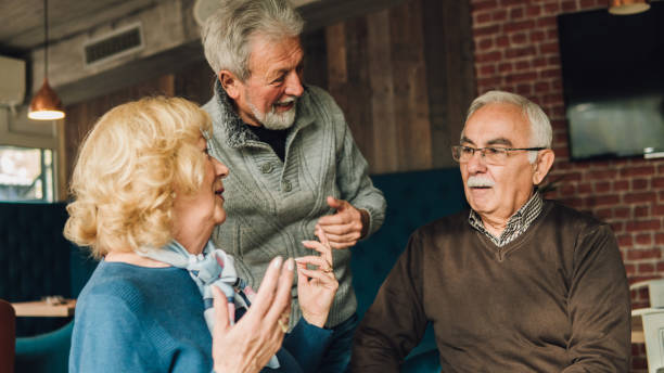 istock Senior people at coffee shop together 1078427782