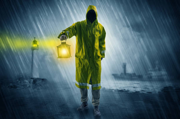istock Man coming with lantern at coast concept 1078428058