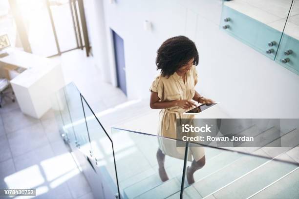 Technology Helps Her Step Up Her Business Game Stock Photo - Download Image Now - Staircase, Steps, Office