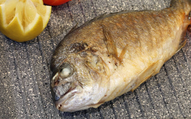istock Sea bream fish grilled in the pan restaurant 1078430868