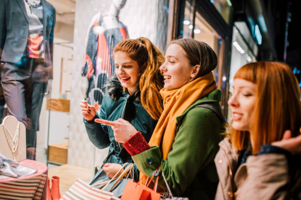 istock Girls looking at store window 1078431484