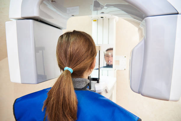 istock A patient in a protective suit is standing next to the device 1078432600