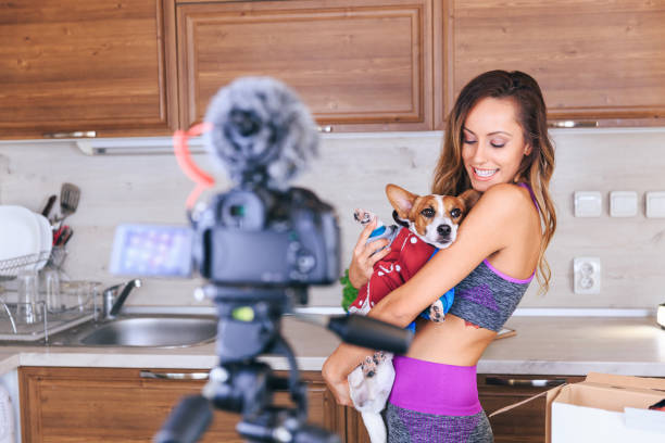istock Female vlogger filming a pet video 1078432974