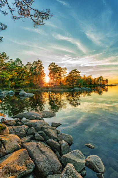 istock Autumn landscape on the lake at sunset time 1078433498