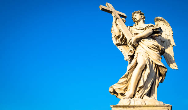 istock Catholic angel with cross 1078434884