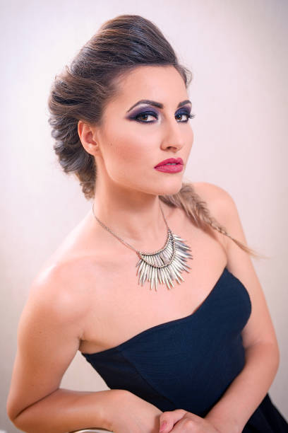 istock Attractive blonde woman with fishtail braid and off shoulders corset 1078437714