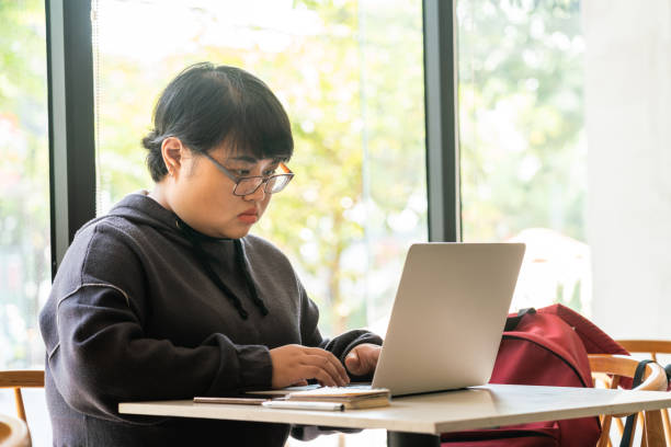 istock Fat Asian freelancer working on laptop 1078443652