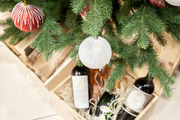 istock wooden wine box under the Christmas tree with red and white balls horizontal 1078444228