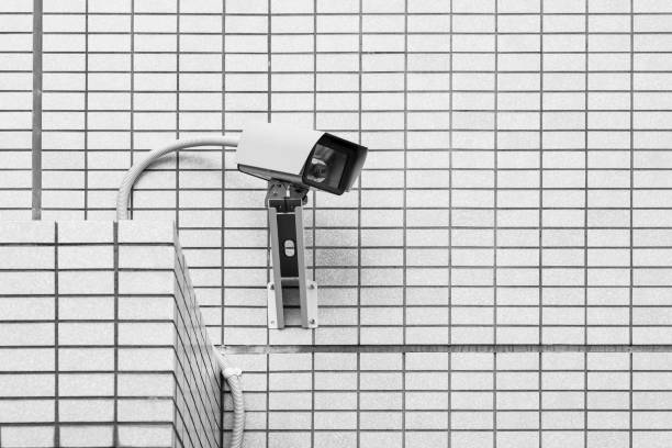 istock Video camera security system on the wall of the building 1078444508