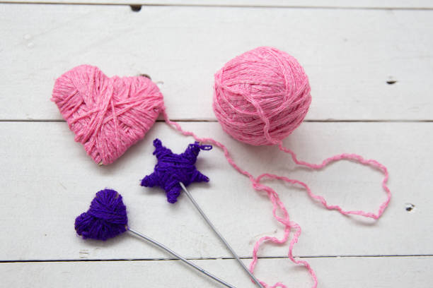 istock a pink heart knitted from woolen threads 1078447960