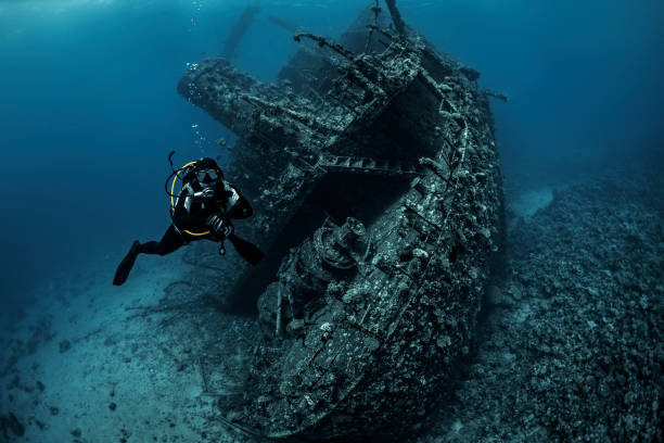 istock Scuba diver examining a large rusted shipwreck under the Red Sea 1078453028