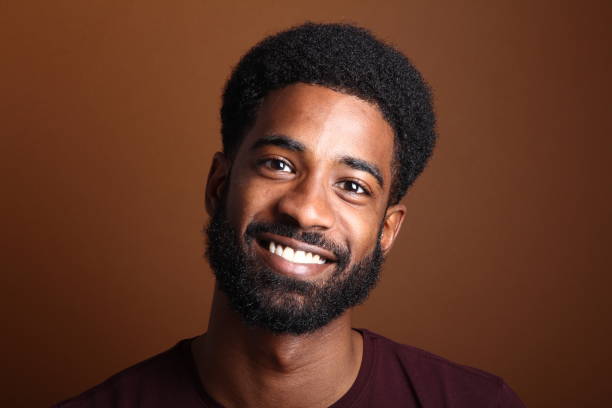 istock Beautiful black man in front of a brown background 1078454498