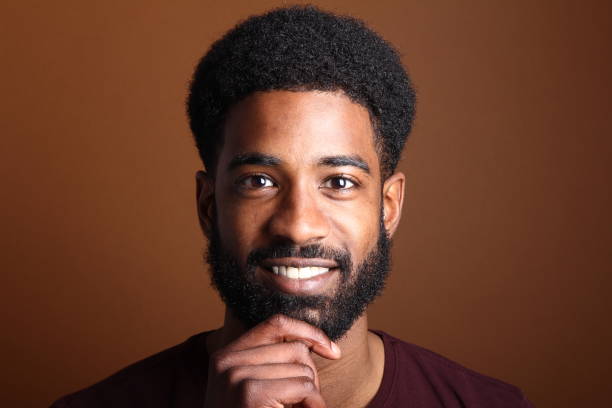 istock Beautiful black man in front of a brown background 1078454500